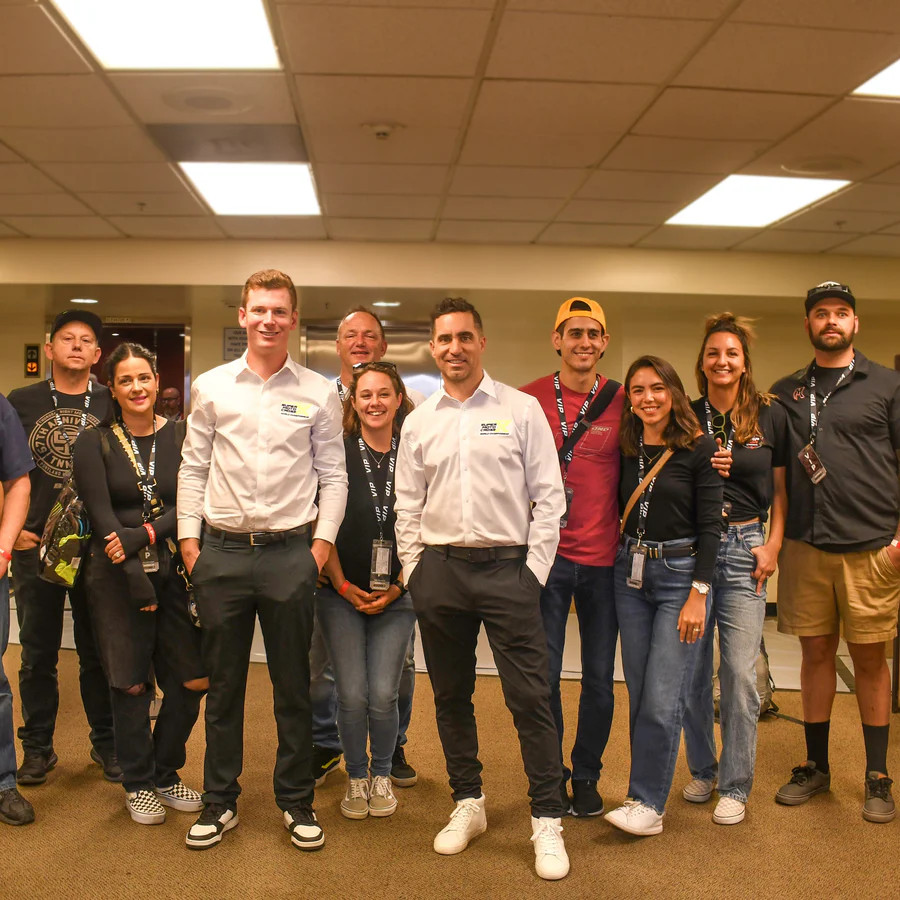 Fans pose for a photo with the Race Day Live crew